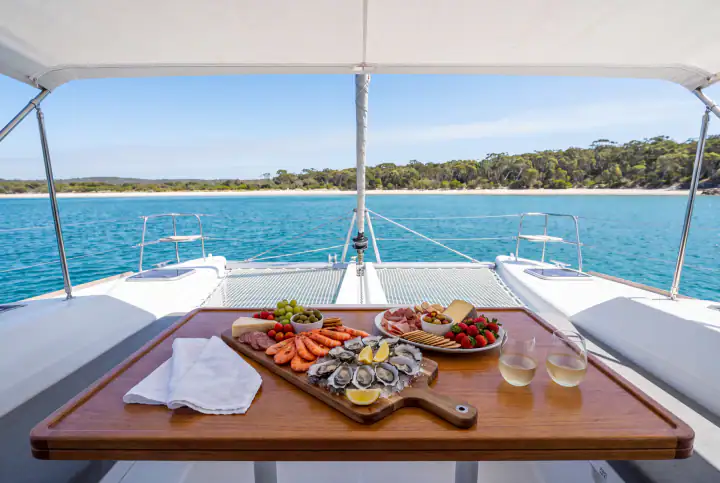 A seafood and grazing platter laid out on the deck table of Discover, anchored on Jervis Bay